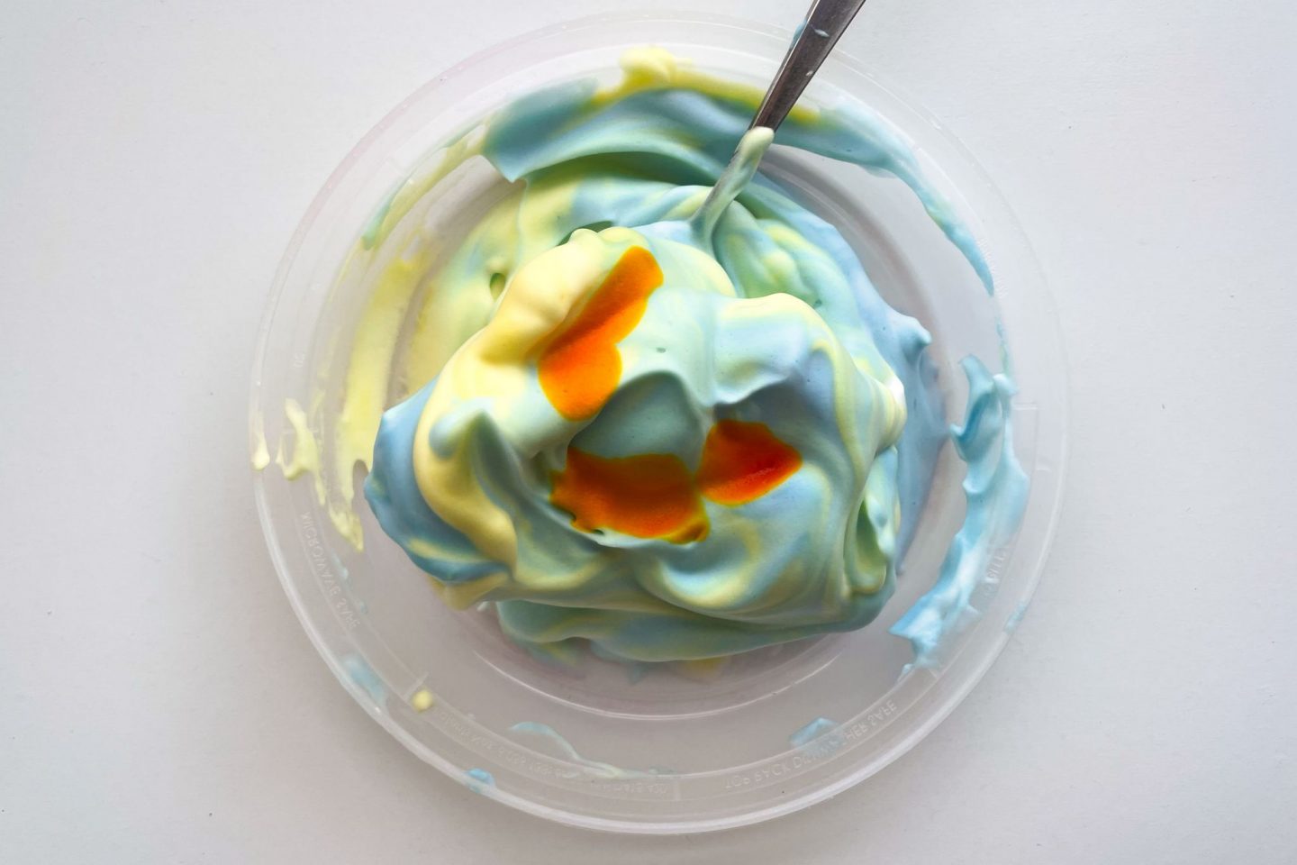 Using shaving cream and food dye to teach children about color theory