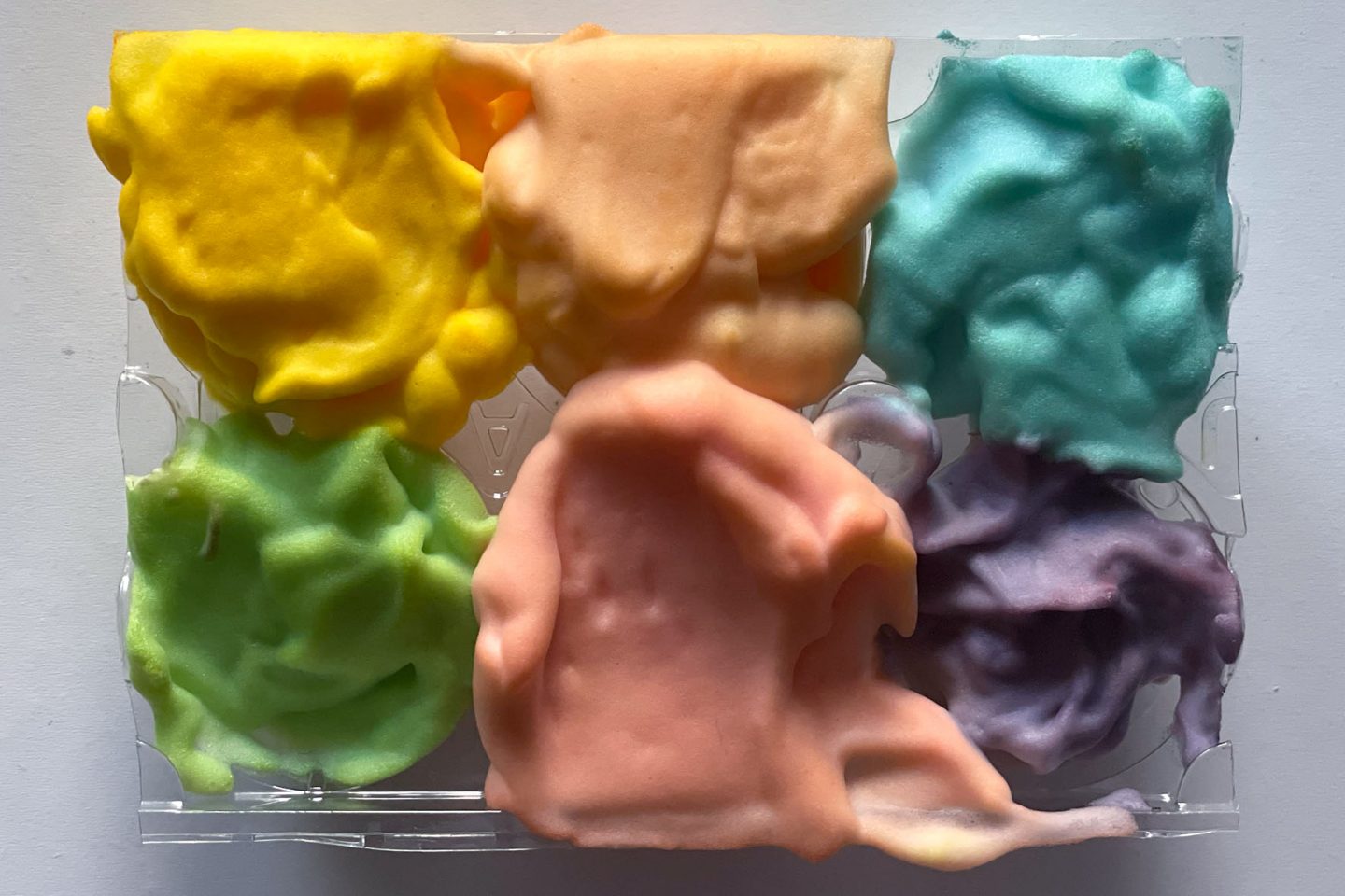 Shaving cream and food dye are used to teach kids about color theory